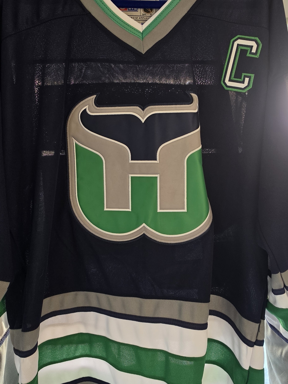 CCM Blue and Green Team Classics NHL Jersey Tag Close-Up